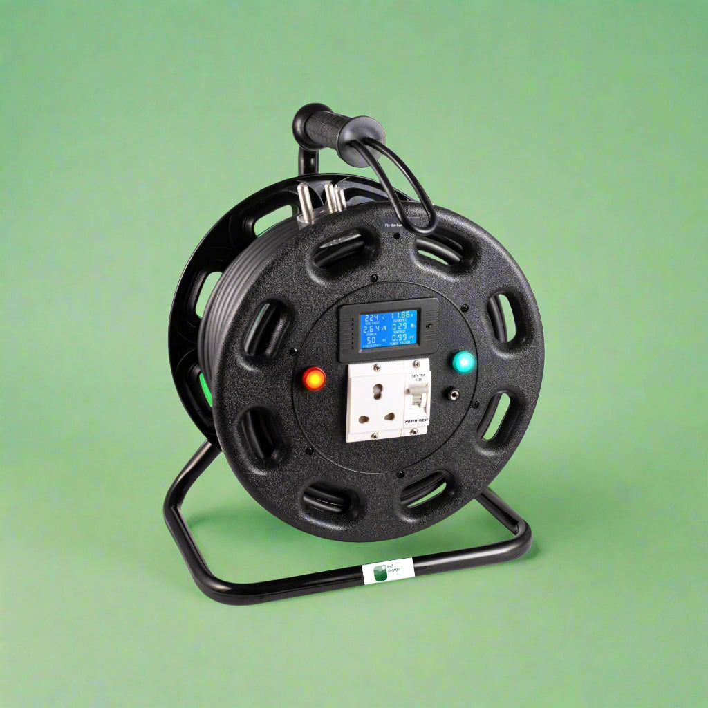 Black cable reel with digital display on a green background