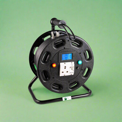 Black cable reel with digital display on a green background